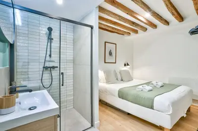 Un ou plusieurs lits dans un hébergement de l'établissement Magnifique appartement pour 6 - Montorgueil