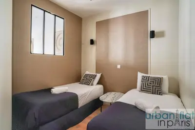 Un ou plusieurs lits dans un hébergement de l'établissement 23 - Charming 3BDR Parisian Apartment in Montorgueil