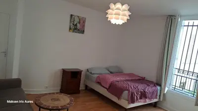 Un ou plusieurs lits dans un hébergement de l'établissement Appartement 9ème
