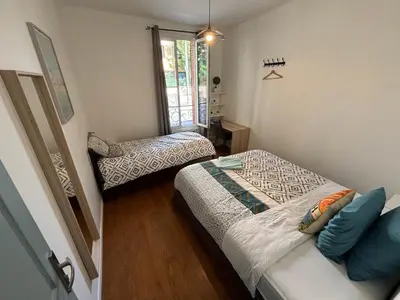Un ou plusieurs lits dans un hébergement de l'établissement B0 Appart 2022 - 10min PARIS/EXPO - 5 rooms/6 beds