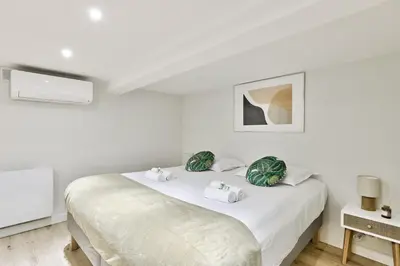 Un ou plusieurs lits dans un hébergement de l'établissement Cosy appartement - Eiffel Tower