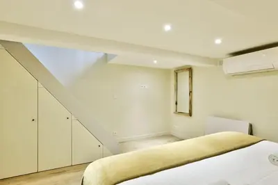 Un ou plusieurs lits dans un hébergement de l'établissement Cosy appartement - Eiffel Tower
