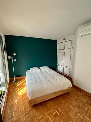 Un ou plusieurs lits dans un hébergement de l'établissement Superbe appartement au porte de Paris et du salon des expositions