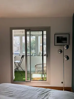 Un ou plusieurs lits dans un hébergement de l'établissement Superbe appartement au porte de Paris et du salon des expositions