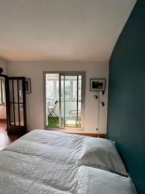 Un ou plusieurs lits dans un hébergement de l'établissement Superbe appartement au porte de Paris et du salon des expositions