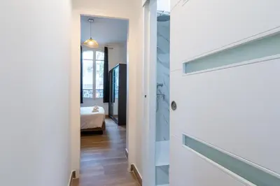 Un ou plusieurs lits dans un hébergement de l'établissement Appartement Métro Alexandre Dumas
