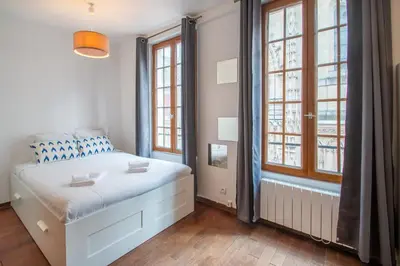 Un ou plusieurs lits dans un hébergement de l'établissement Studio au cœur du Marais