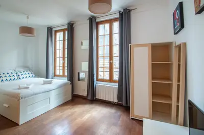 Un ou plusieurs lits dans un hébergement de l'établissement Studio au cœur du Marais