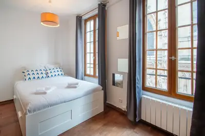 Un ou plusieurs lits dans un hébergement de l'établissement Studio au cœur du Marais