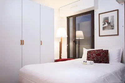 Un ou plusieurs lits dans un hébergement de l'établissement GuestReady - Studio lumineux à Folie-Méricourt
