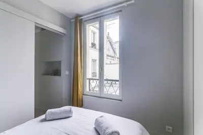 Un ou plusieurs lits dans un hébergement de l'établissement GuestReady - Serene 1BR Apt in Folie-Méricourt