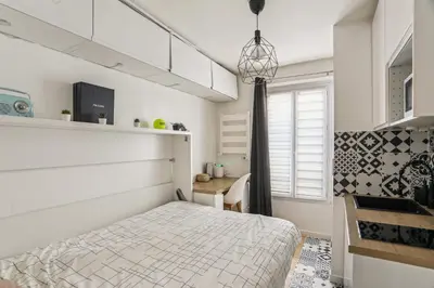 Un ou plusieurs lits dans un hébergement de l'établissement Small comfortable studio near Eiffel Tower