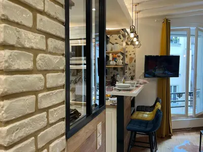 Cuisine ou kitchenette dans l'établissement Appartement Montmartre Sacré Cœur