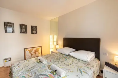 Un ou plusieurs lits dans un hébergement de l'établissement GuestReady -Appart lumineux près de la Place d'Italie
