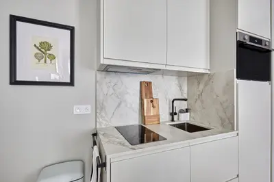 Cuisine ou kitchenette dans l'établissement Residense Notre Dame de Paris by Studio prestige