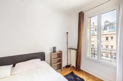 Un ou plusieurs lits dans un hébergement de l'établissement GuestReady -Superbe Appartement dans le 14ème Arr.