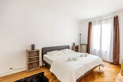Un ou plusieurs lits dans un hébergement de l'établissement GuestReady -Superbe Appartement dans le 14ème Arr.