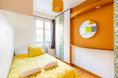 Un ou plusieurs lits dans un hébergement de l'établissement GuestReady - Apt clair et spacieux à Paris !