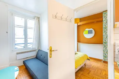 Coin salon dans l'établissement GuestReady - Apt clair et spacieux à Paris !