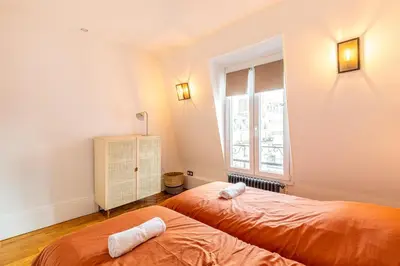 Un ou plusieurs lits dans un hébergement de l'établissement GuestReady - Appt Élégant près de la Tour Eiffel