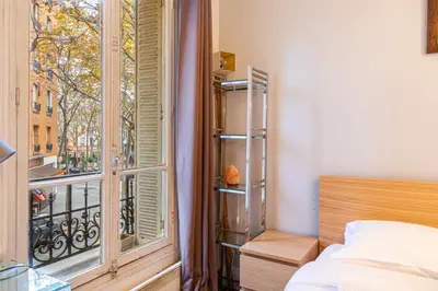 Un ou plusieurs lits dans un hébergement de l'établissement GuestReady - Appt Chic dans Le Marais
