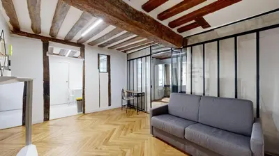 Coin salon dans l'établissement 323 Suite Louis - Superbe Appartement à Paris