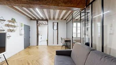 Coin salon dans l'établissement 323 Suite Louis - Superbe Appartement à Paris