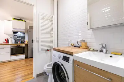 Cuisine ou kitchenette dans l'établissement GuestReady - Chic Apt Near Passerelle Bichat