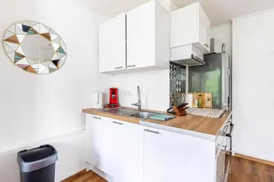 Cuisine ou kitchenette dans l'établissement GuestReady - Chic Apt Near Passerelle Bichat