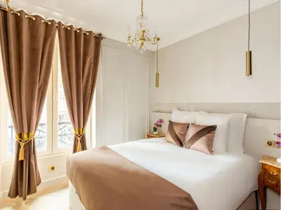 Un ou plusieurs lits dans un hébergement de l'établissement Merveil - Luxury Suite - Louvre - Ours II