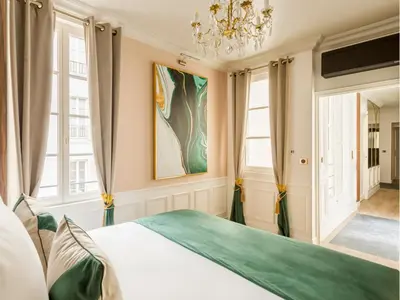 Un ou plusieurs lits dans un hébergement de l'établissement Merveil - Luxury Suite - Champs Elysees - Boissy