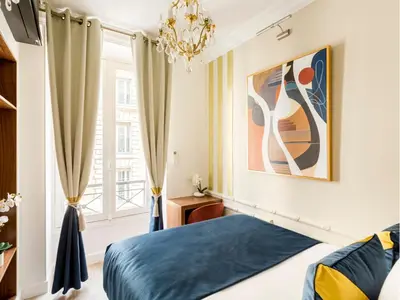 Un ou plusieurs lits dans un hébergement de l'établissement Merveil - Luxury Suite - Champs Elysees - Boissy