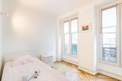 Un ou plusieurs lits dans un hébergement de l'établissement GuestReady - Séjour de Charme dans le 4ème