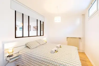 Un ou plusieurs lits dans un hébergement de l'établissement GuestReady - Appartement baigné de lumière