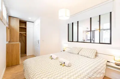 Un ou plusieurs lits dans un hébergement de l'établissement GuestReady - Appartement baigné de lumière