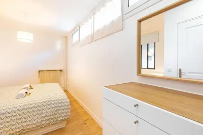 Un ou plusieurs lits dans un hébergement de l'établissement GuestReady - Appartement baigné de lumière