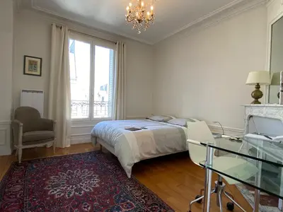 Un ou plusieurs lits dans un hébergement de l'établissement Nice Sunny Central Paris