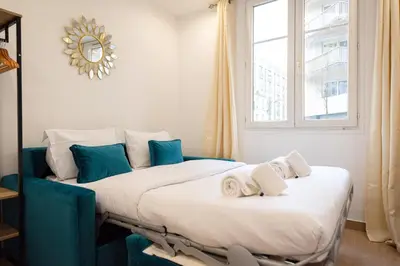 Un ou plusieurs lits dans un hébergement de l'établissement Cosy apartment in Paris