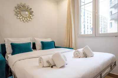 Un ou plusieurs lits dans un hébergement de l'établissement Cosy apartment in Paris