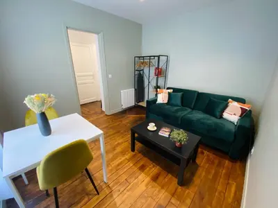 Coin salon dans l'établissement Les Appartements du Grand Hôtel Clichy Paris