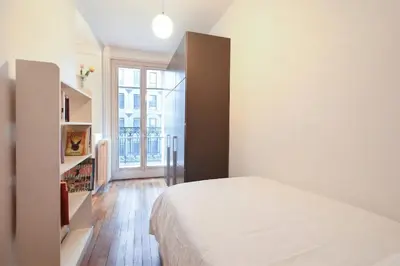 Un ou plusieurs lits dans un hébergement de l'établissement GuestReady - Appt lumineux dans le Quartier Latin