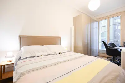 Un ou plusieurs lits dans un hébergement de l'établissement GuestReady - Appt lumineux dans le Quartier Latin