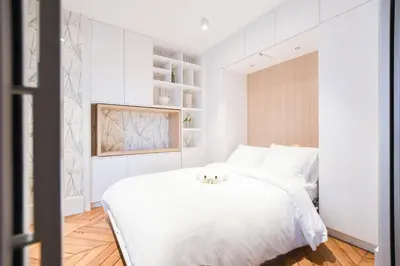 Un ou plusieurs lits dans un hébergement de l'établissement GuestReady - Apt de luxe Proche de la Tour Eiffel