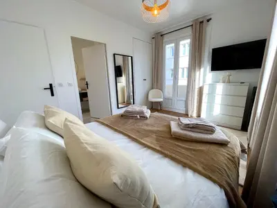 Un ou plusieurs lits dans un hébergement de l'établissement L'appartement Edouard