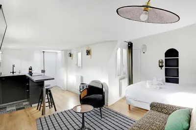 Un ou plusieurs lits dans un hébergement de l'établissement Pick A Flat's Apartements in Louvre-Rivoli - Rue du Roule