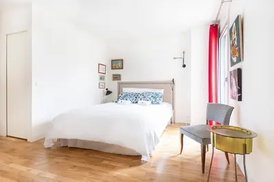 Un ou plusieurs lits dans un hébergement de l'établissement Superbe appartement au coeur de Paris