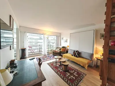 Coin salon dans l'établissement Appartement avec balcon et parking à Paris Alésia