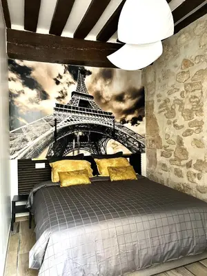 Un ou plusieurs lits dans un hébergement de l'établissement MARAIS Appartement 2 Chambres 2 Salles de bain - SPA JACUZZI !