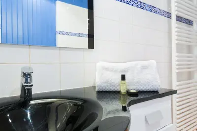 Coin salon dans l'établissement GuestReady - Très bel Appartement confortable