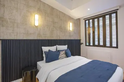 Un ou plusieurs lits dans un hébergement de l'établissement Apartment Saint Germain des Prés by Studio prestige